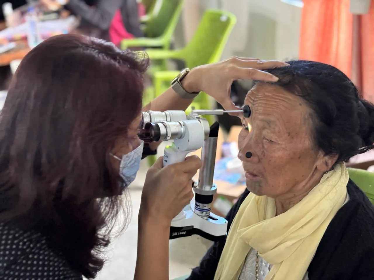 Specialist explaining post-operative care for cataract referral cases.